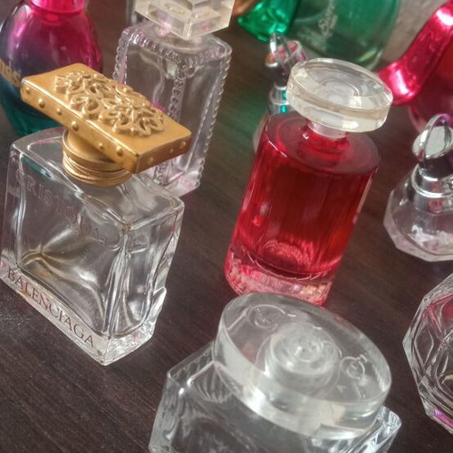 Collection of 29 empty perfume miniatures like new
