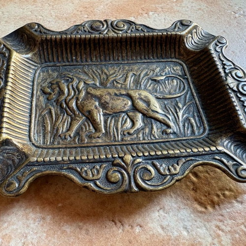 Vintage brass ashtray with lion carving, like new