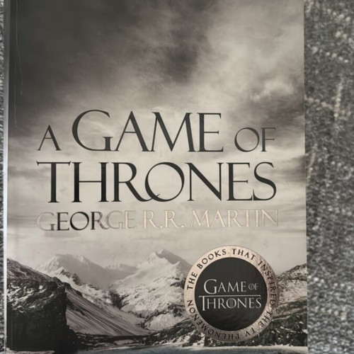 A Game of Thrones book with fake George RR Martin signature new, English
