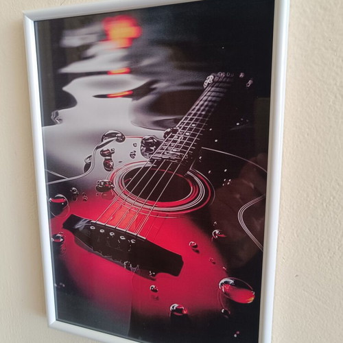 Decorative frame 30×20 cm with guitar theme like new