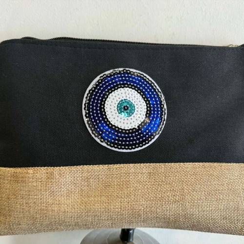 Black clutch bag with blue eye and leather strap new