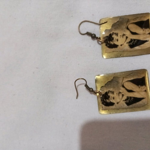 Metal earrings used with figure