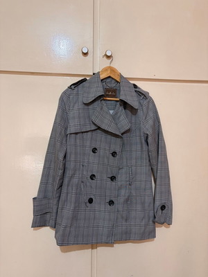 Trench coat used in timeless plaid design, size L