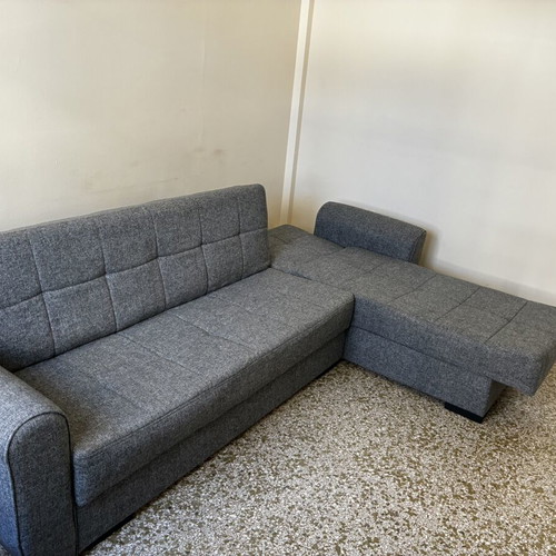 Corner sofa bed with storage compartments