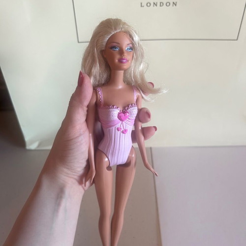 Mattel Barbie Beach doll with pink swimsuit and fuchsia dress