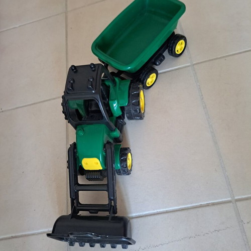 Plastic toy tractor with excavator and detachable trailer