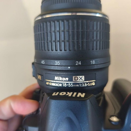 Nikon D3000 camera with AF-S 18-55mm f/3.5-5.6 lens and bag