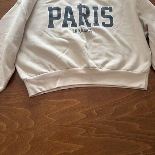Stradivarius S white/cream sweater with Paris, like new, small black dot stain
