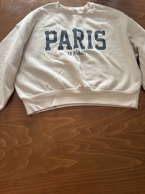 Stradivarius S white/cream sweater with Paris, like new, small black dot stain