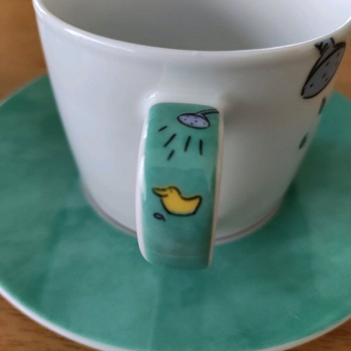 Set of 2 coffee cups with saucers like new, turquoise with hippopotamus