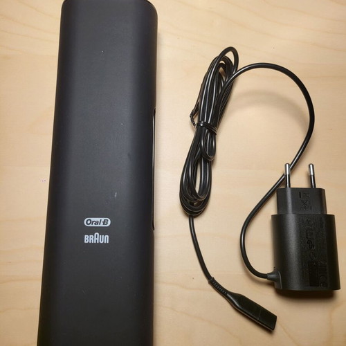 Oral-B Genius electric toothbrush with charging travel case used