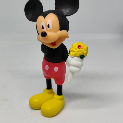 Collectible Mickey Mouse figure like new with bouquet