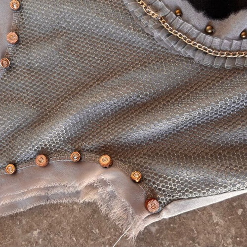 Women's sleeveless blouse gray like new, size small with studs and holes