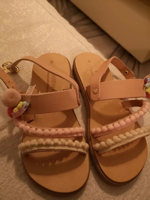 Handmade children's sandals size 30, beige with pom-poms