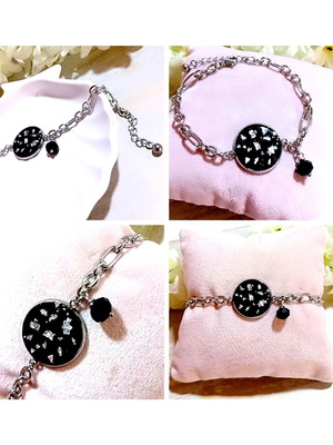 Handmade steel bracelet with iridescent black motif and silver flakes