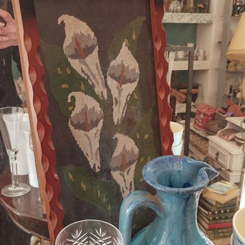 Vintage embroidery lilies in frame used with protective glass