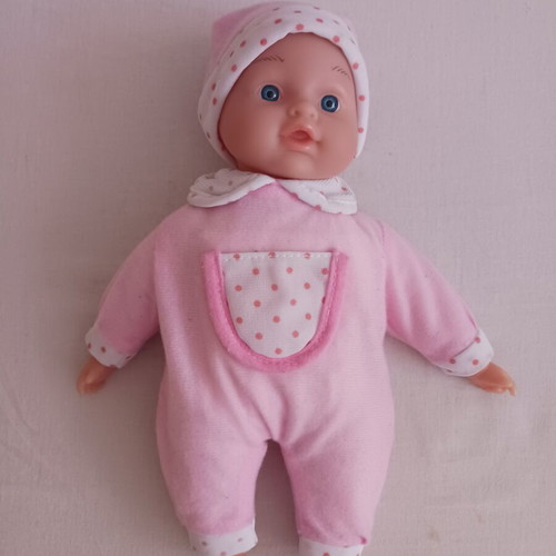 Baby doll with pink clothes like new