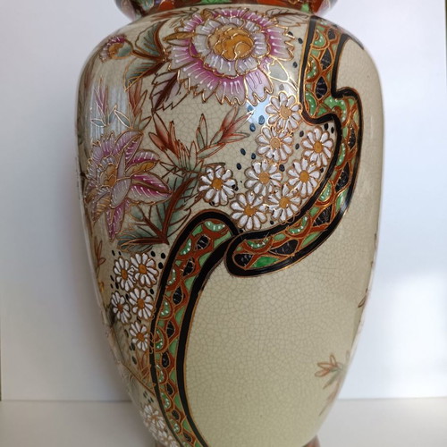 Tall decorative vase with intricate floral designs like new