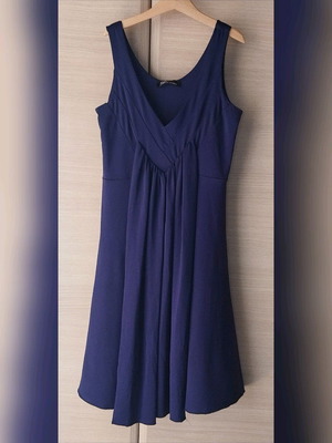 Cocktail dress new with metallic color and ribbons