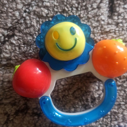 Teether and rattle with handle