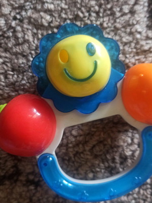 Teether and rattle with handle
