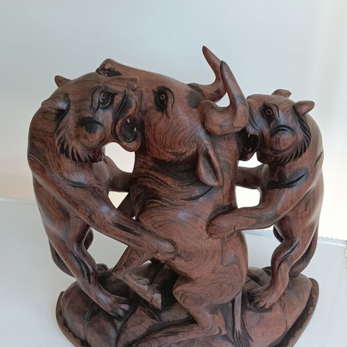 Hunting scene with buffalo and predators wood carving