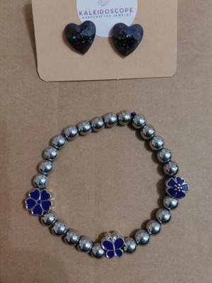 Handmade jewelry set with purple bracelet and earrings