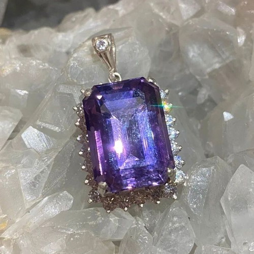 Silver pendant with large cut natural amethyst stone and moissanites