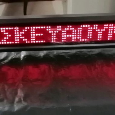 Electronic sign with running letters and clock used, 106x11 cm