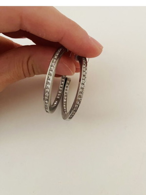 Silver hoop earrings with rhinestones used