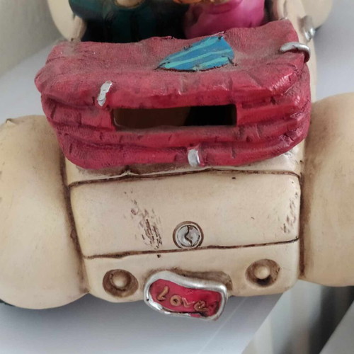 Ceramic funny money box, 25 cm length, funny couple in car, like new