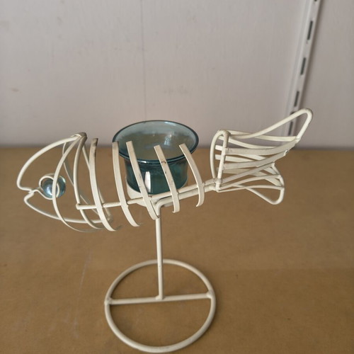 Metal Fish Skeleton Candlestick like new with blue glass base