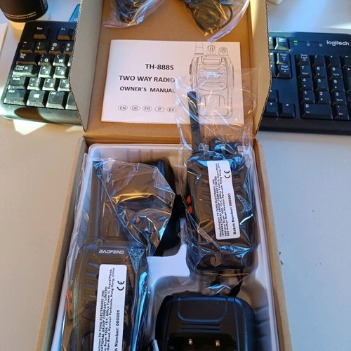 Baofeng two wireless intercoms new with chargers and headsets