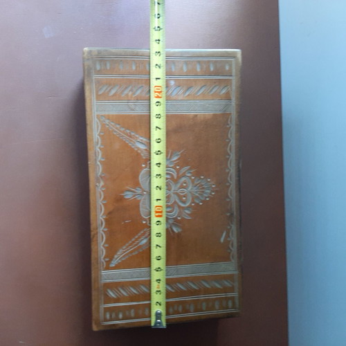 Wooden jewelry box used with carved decorations and red lining