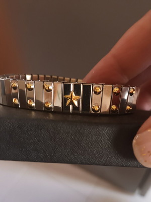Steel bracelet like new with gold details