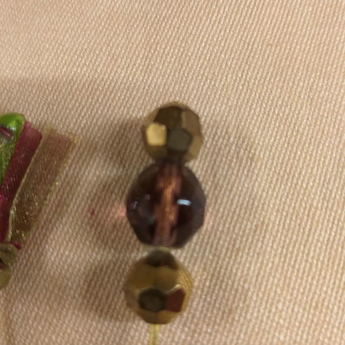 Lapel pins used, two small with enameled detail
