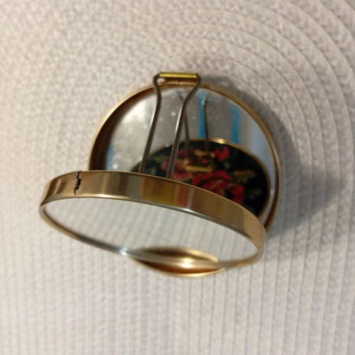 Vintage folding travel mirror with floral design