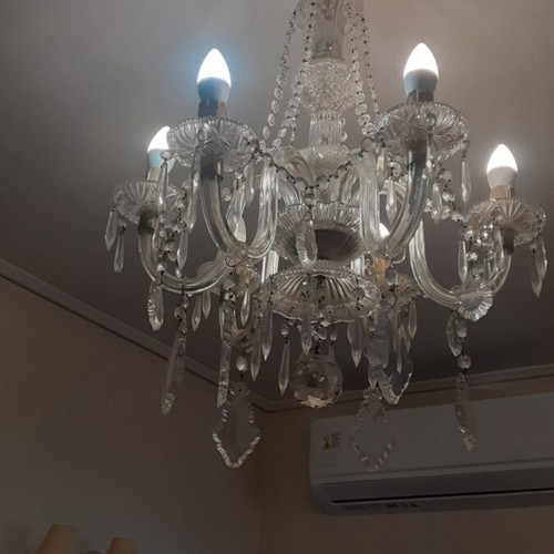 Vintage lighting set with heavy crystal seven-light chandelier and two matching two-light sconces