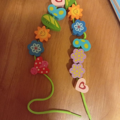 Wooden toy with figures and cord used, ages 1.5 to 4
