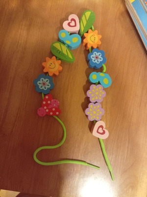 Wooden toy with figures and cord used, ages 1.5 to 4
