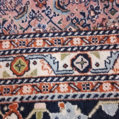 Handmade wool rug used, approximately 10 sqm
