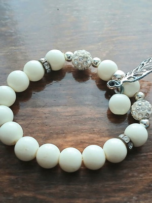 Bracelet with white beads and silver decorative elements like new