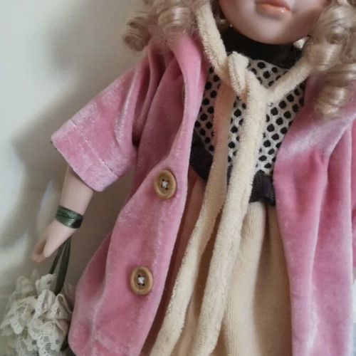 Collectible doll with coat and handbag like new