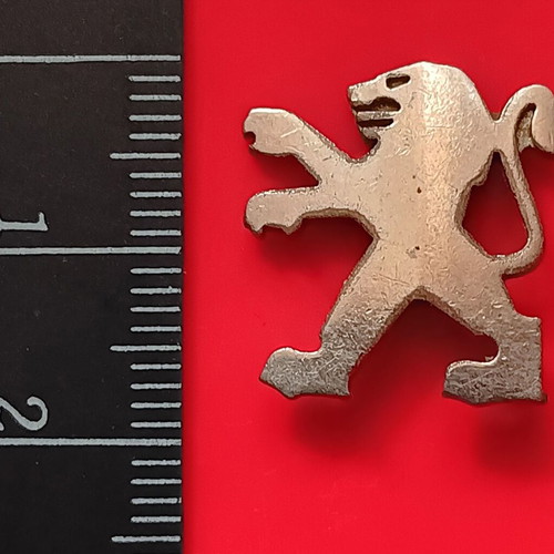 Small metal lion badge used