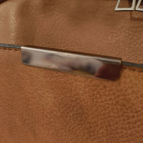 Brown backpack like new with leather texture and two compartments