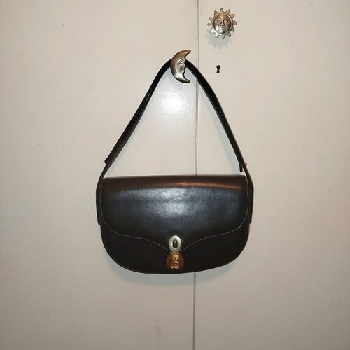 Black leather vintage handbag used with white residue
