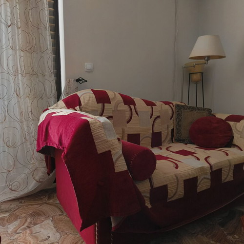 Two-seater sofa used with cover and cushions