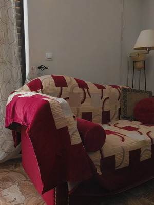 Two-seater sofa used with cover and cushions