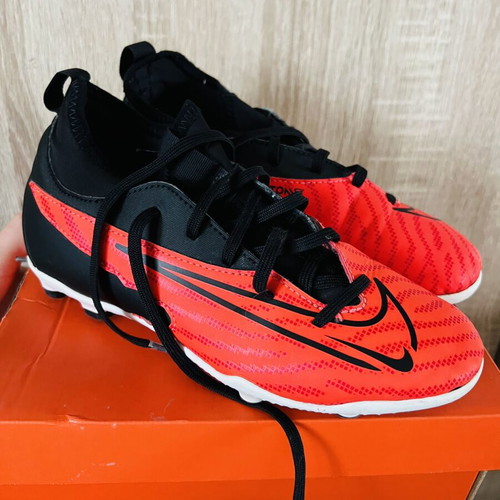 Nike football shoes like new, sizes 22 and 35, black and red