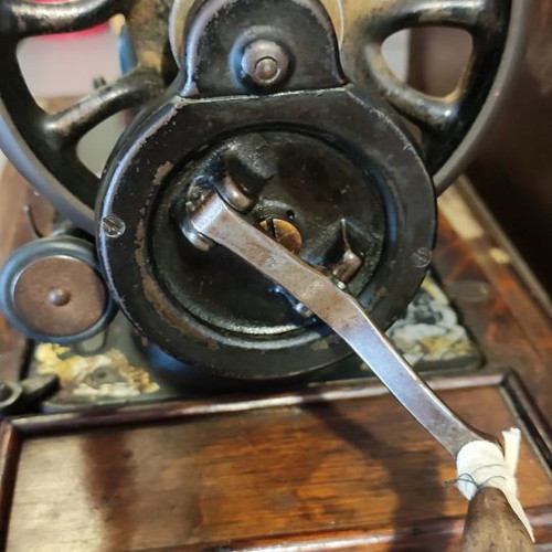 Singer sewing machine used with original wooden cover and key